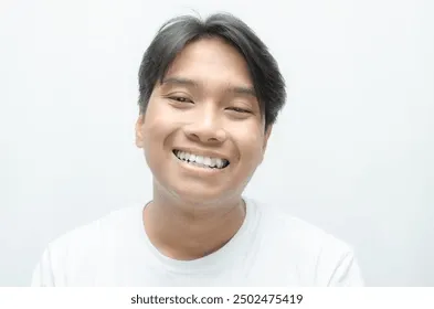 young-asian-man-smiling-showing-260nw-2502475419.webp